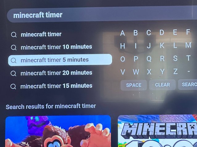 Screenshot of a YouTube search for "Minecraft 5 minute timer" displayed on a TV screen.